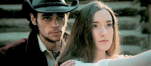 Jacob Stieneker as William McCarthy, teaching his wife Jude (Michaela Semak) how to handle a six-gun in Gunfight at Cold Cross (2023)