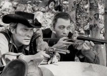 Ross Hagen as Justin Kane and Brad Thomas as Jack Slade, preparing to defend themselves against a posse in Mark of the Gun (1969)