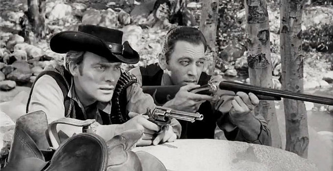 Ross Hagen as Justin Kane and Brad Thomas as Jack Slade, preparing to defend themselves against a posse in Mark of the Gun (1969)