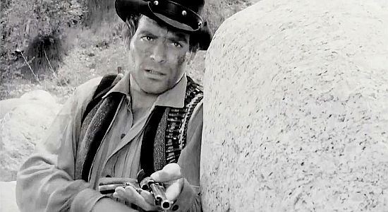 Ross Hagen as Justin Kane, reloading his six-gun during a shootout in Mark of the Gun (1969)