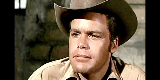 Doug McClure as Trampas, a young cowhand mostly interested in women and gambling in Backtrack! (1969)