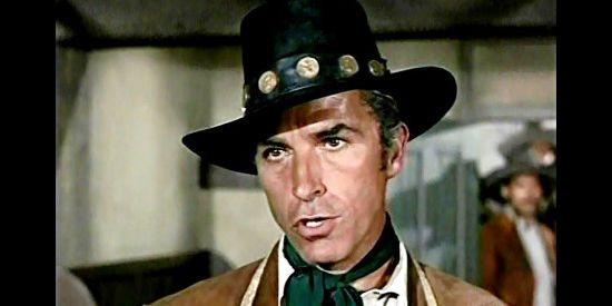 Fernando Lamas as Capt. Estrada, ordering the Texas Ranger trio out of Mexico in Backtrack! (1969)