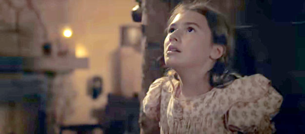 Georgia MacPhail as Elizabeth Kittredge, terrified as Apache attack the cabin where she lives in Horizon, An American Saga, Chapter 1 (2024)