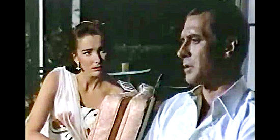 Jock Mahoney as Slim Carter, wondering whether Clover Doyle (Julie Adams) will let any man love her in Slim Carter (1957)