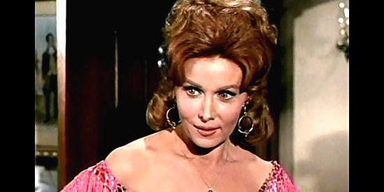 Rhonda Fleming as Carmelita Flanagan, trying to keep Trampas out of harm's way in Backtrack! (1969)