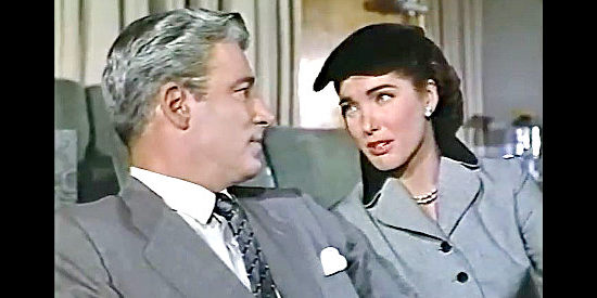 William Hopper as director Joe Brewster, conferring with Clover Doyle (Julie Adams) after screening Slim's first move in Slim Carter (1957)