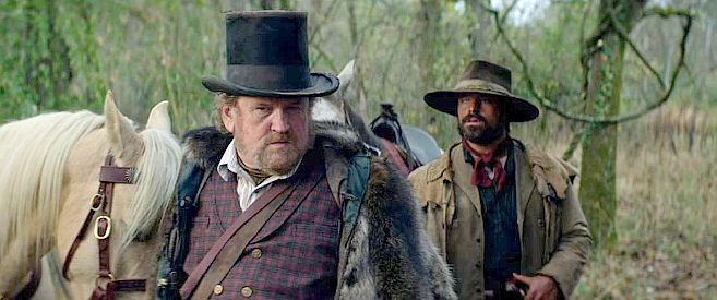 Colm Meaney as Caleb and Jesse Hutch as Spike, trailing beaver pelt thieves in The Ballad of Davy Crockett (2024)