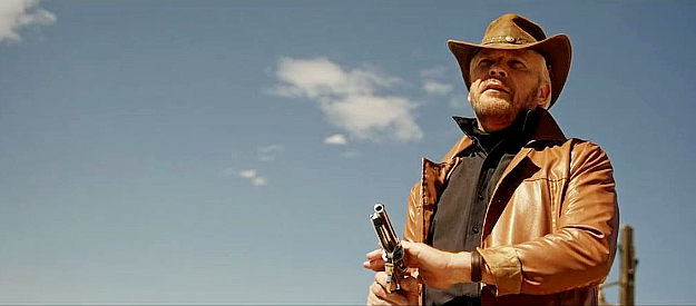 Dallas Valdez as Joe Crist, about to dole out some of God's vengeance, six-gun style in Joe Crist (2024)