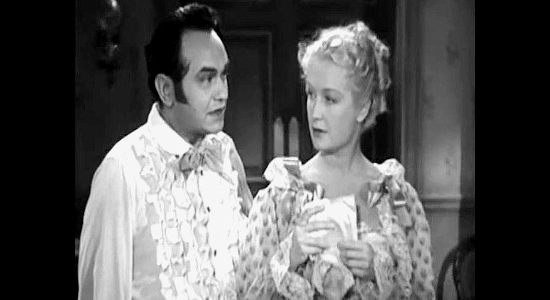 Edward G. Robinson as Luis Chamalis, explaining his proposition to Mary Rutledge (Miriam Hopkins) in Barbary Coast (1935)