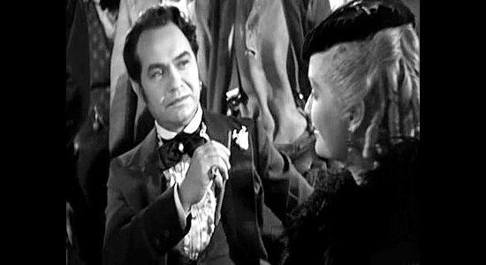 Edward G. Robinson as Luis Chamalis, meeting Mary Rutledge, the woman he'll nickname Swan in Barbary Coast (1935)