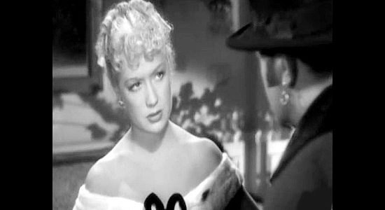 Miriam Hopkins as Mary Rutledge, listening to Luis Chamalis threaten harm to any man she's found with in Barbary Coast (1935)