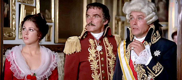 Ottavia Piccolo as Contessina Ortensia, Stanley Baker as Col. Huerta and Alain Delon as the governor, reacting to the mark Zorro left on the royal chambers in Zorro (1975)