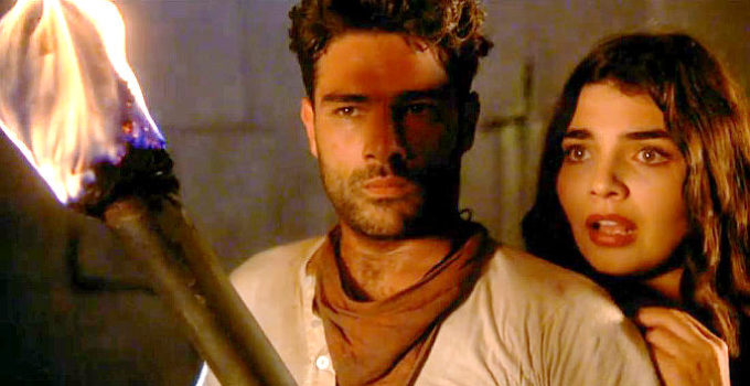 Marco Leonardi as Johnny Madrid and Ara Celi as Esmeralda in From Dusk Till Dawn 3, The Hangman's Daughter (1999)