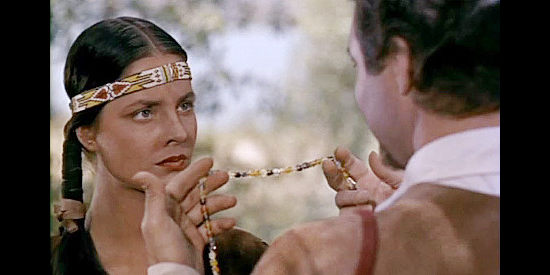 Jody Lawrance as Pocahontas, unimpressed by the beads John Smith is offering her in Captain John Smith and Pocahontas (1953)