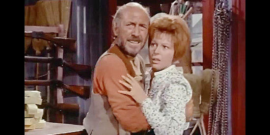 Lionel Jeffries as Luke Billings, his molestation of Priss Dobbs (Anne Aubry) interrupted by gunfire in The Hellions (1961)