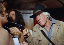 Lee Marvin as Sam Longwood, threatening boxer Vishniac (Howard Platt) along with Joe Knox (Oliver Reed) in The Great Scout and Cathouse Thursday (1976)