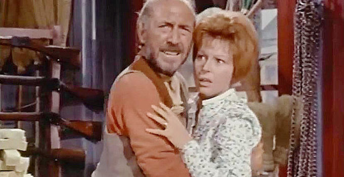 Lionel Jeffries as Luke Billings, his molestation of Priss Dobbs interrupted by gunfire in The Hellions (1961)