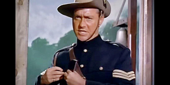 Richard Todd as Sgt. Sam Hargis, looking for someone to stand with him against the Billings clan in The Hellions (1961)