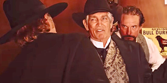 Eric Roberts as Arlis Blackthorn, Caleb Wilkenson's hired gun, confronted by A. Pettigrew (Davy Williams) and Beau Boone (Shane Clouse) in Mr. Pettigrew (2024)