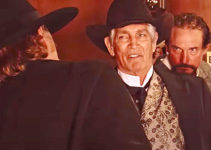 Eric Roberts as Arlis Blackthorn, Caleb Wilkenson's hired gun, confronted by A. Pettigrew (Davy Williams) and Beau Boone (Shane Clouse) in Mr. Pettigrew (2024)