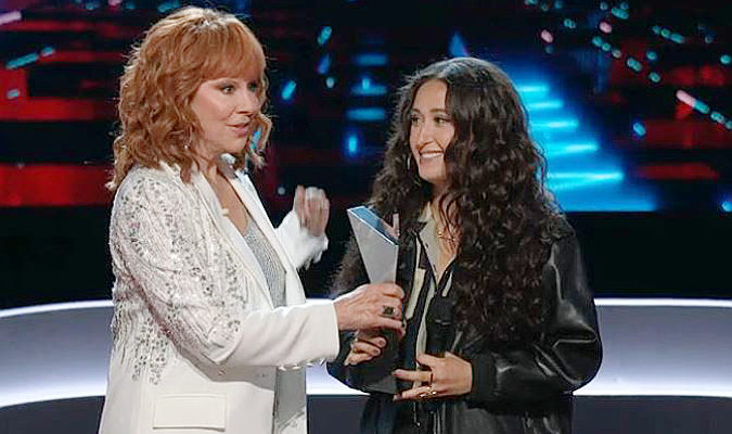 Reba McEntire shows Frankie Torres the winner's trophy on The Voice. Frankie still opted to join Team Gwen Stefani. (NBC Photo)