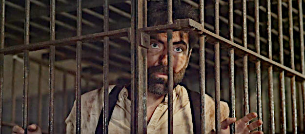 Andrea Zirlo as Thomas Riley, trying to make a deal that will get him out of a jail cell in The Killing of Billy the Kid (2023)