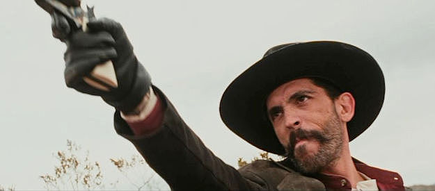 Chris James Rivera as Mac, a member of the outlaw gang in Ghosts of Red Ridge (2024)