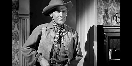 Forrest Tucker as Zeke Butler, convinced Bill Foss has something to do with the stage holdups in Adventures in Silverado (1948)