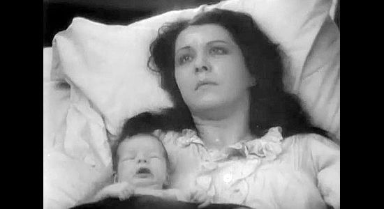 Fritzi Ridgeway as the mother, knowing she's not going to survive to raise her son in Hell's Heroes (1929)