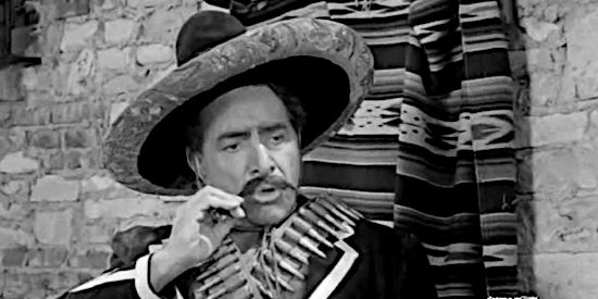 J. Carrol Naish as Yaqui Jack, explaining how much Matt Quigg will have to cough up to win his freedom in Yaqui Drums (1956)