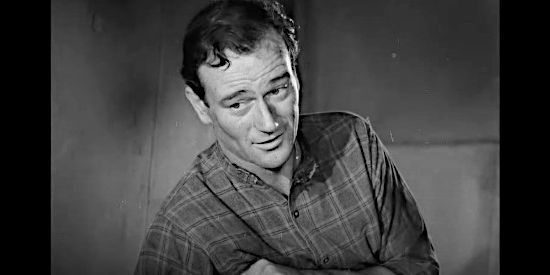 John Wayne as Duke Fergus, staying by Flaxen's side after she's injured during the earthquake in Flame of the Barbary Coast (1945)