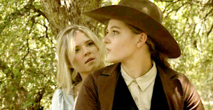 Nicole Mattox as Ellie and Lisa Butala as Dunn, concerned they won't be able to escape riding double in Lady Outlaw (2024)