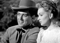 William Bishop as Bill Foss and Gloria Henry as Jeannie Manning on a stagecoach ride in Adventures in Silverado (1948)