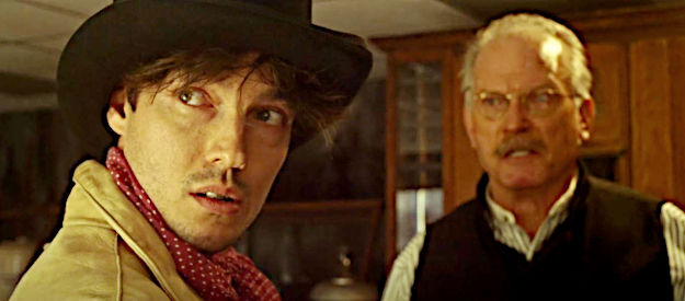 Paul Grant (aka Paul Addison) as Billy the Kid, threatening to kill a bank teller in The Killing of Billy the Kid (2023)