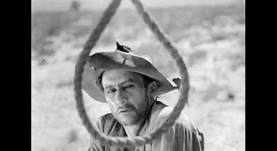 Raymond Hatton as 'Barbwire' Tom Gibbons, checking out the noose on the way to New Jerusalem in Hell's Heroes (1929)