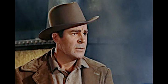 Rob Cameron as Kyle Ramlo, watching his new railroad bridge collapse in Woman of the North Country (1952)