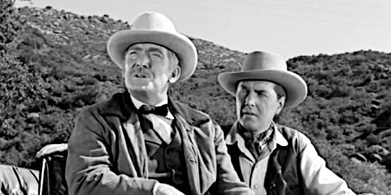 Roy Roberts as Matt Quigg and Robert Hutton as his son Lute, explaining the Spanish Land Grant they're using to gain control of all the nearby ranches in Yaqui Drums (1956)