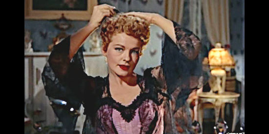 Ruth Hussey as Catherine Powell, showing her true colors as a woman who has no intention of sharing her man's struggles in Woman of the North Country (1952)