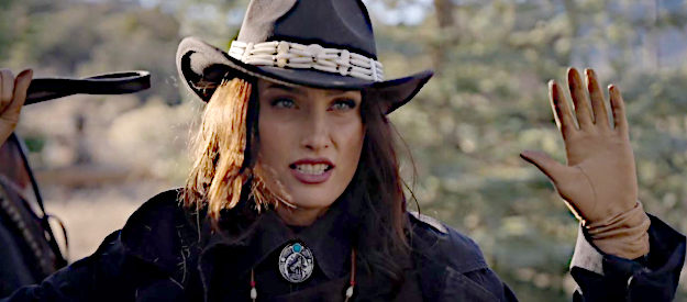 Tatina Neva as Ellen, the female bounty hunter the sheriff and Ivan cross paths with in Taken from Rio Bravo (2024)