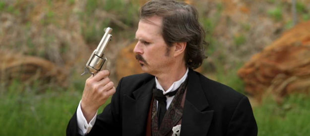 Tom Zembrod as Doc Holliday, wondering why his gun failed to fire in Doc Holliday 3 (2024)