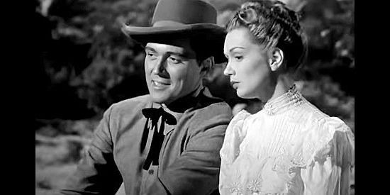 William Bishop as Bill Foss and Gloria Henry as Jeannie Manning on a stagecoach ride in Adventures in Silverado (1948)