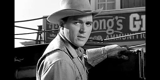 William Bishop as Bill Foss, arriving in SIlverado to a less than warm welcome in Adventures in Silverado (1948)