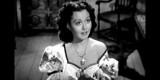 Adele Mara as Elena Conchita Montoya, trying to convince Henrietta that a mouse is nothing to fear in Shut My Big Mouth (1942)