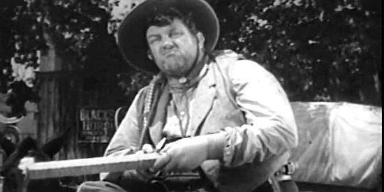 Andy Devine as Slim, counting cattle to make sure Steve Logan isn't cheated in Frontier Badmen (1943)