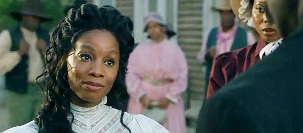 Anika Noni Rose as Jessie Lee, meeting Johnny and insisting the pen is mightier than the six-gun in Outlaw Johnny Black (2023)