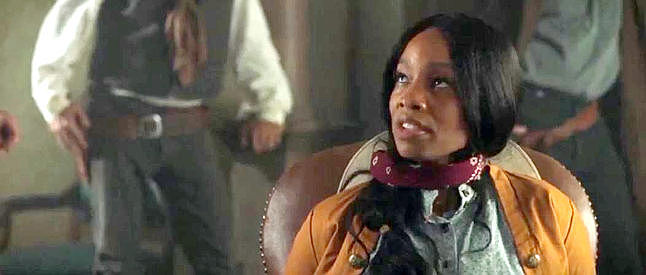 Anika Noni Rose, defiant in the face of Tom Shealey's threats to burn the town of Hope Springs in Outlaw Johnny Black (2023)