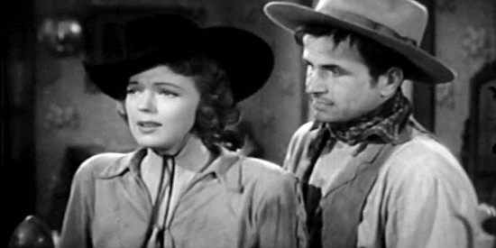 Anne Gwynne as Chris Prentice, smitten with Steve to the dismay of Noah Beery Jr. as Jim Cardwell in Frontier Badmen (1943)