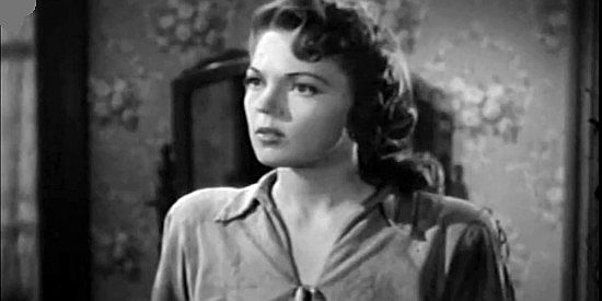 Anne Gwynne as Chris Prentice, the Texas cattle queen romanced by Steve Logan and Jim Cardwell in Frontier Badmen (1943)