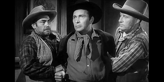 Barry Sullivan as Tom Horn, subdued by two men after being cheated out of $200 in a card game in Bad Men of Tombstone (1949)