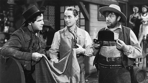 Broderick Crawford as Swanee and Andy Devine (right) as Meadows welcome Easterner Tim Mason to the West in Trail of the Vigilantes (1940)